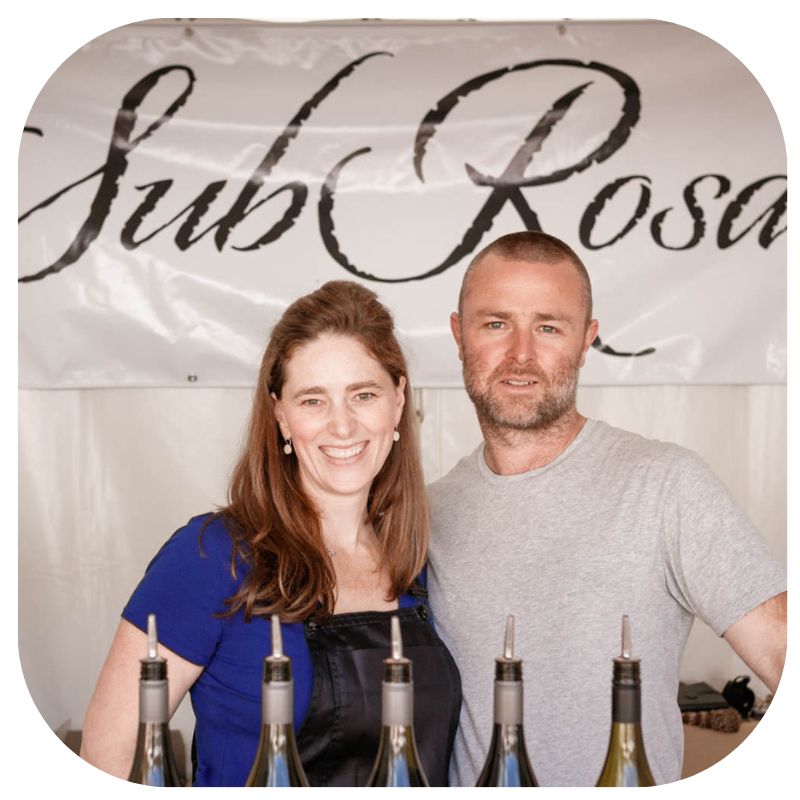 nancy panter and adam louder co-owners of subrosa showing subrosa wine at a tasting