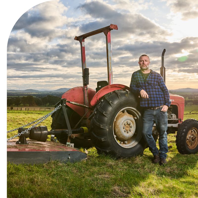adam louder, winemaker of subrosa wines, standing in front of the farms tractor in the grampians wine region