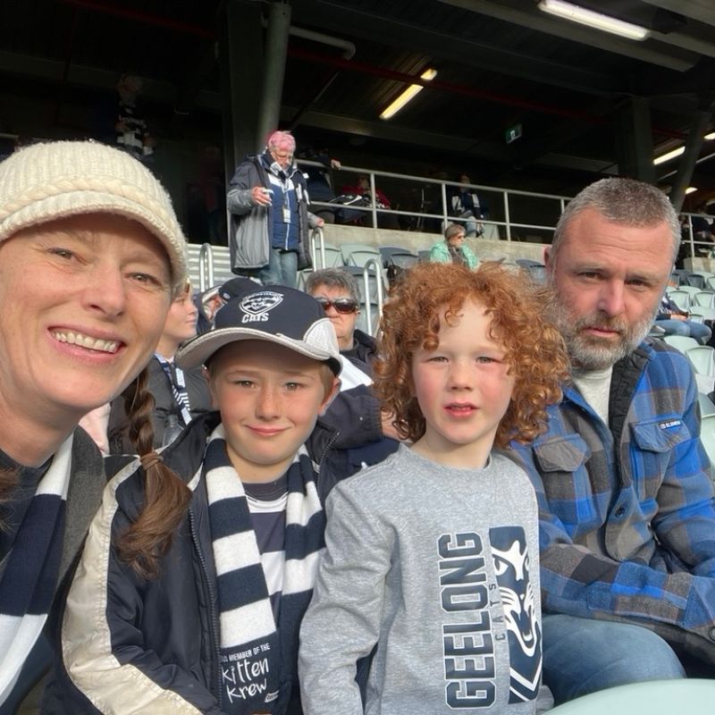 adam louder, nancy panter and their sons at the geelong afl game